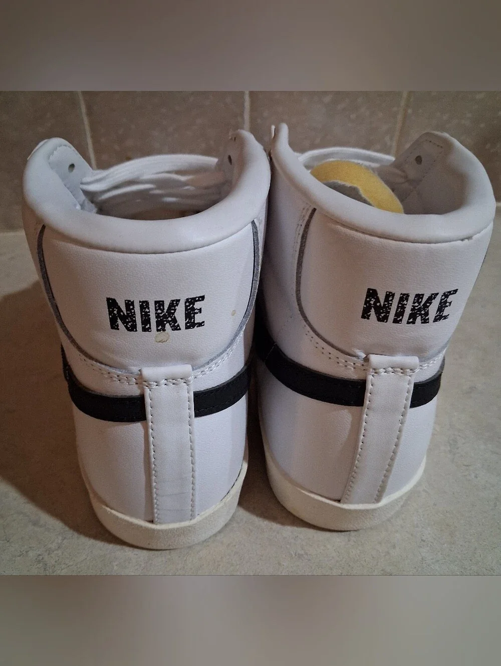 Nike Blazer Mid '77 vintage sneakers, bold black leather Swoosh